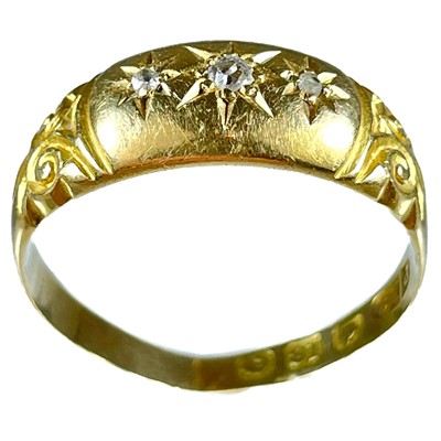 Lot 158 - An Edwardian 18ct diamond set three stone ring.