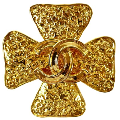 Lot 545 - A Chanel gold plated clover brooch.