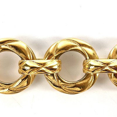 Lot 555 - A Chanel gold plated hoop long chain necklace.