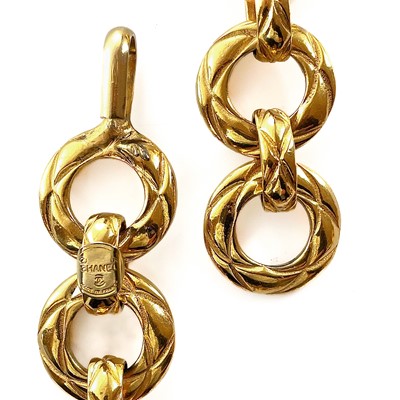 Lot 555 - A Chanel gold plated hoop long chain necklace.