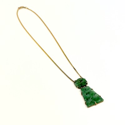 Lot 81 - A modern 9ct gold Chinese green jade pendant necklace.