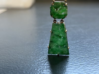 Lot 81 - A modern 9ct gold Chinese green jade pendant necklace.