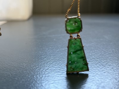 Lot 81 - A modern 9ct gold Chinese green jade pendant necklace.