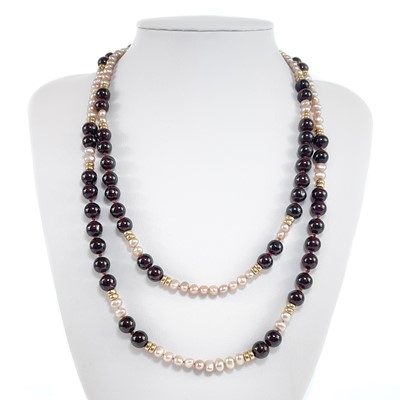 Lot 437 - A modern 9ct garnet and pearl long necklace.