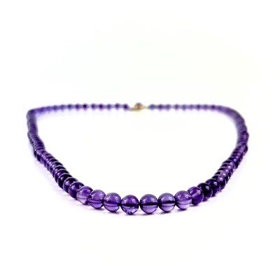 Lot 415 - A modern amethyst bead necklace with 9ct clasp.
