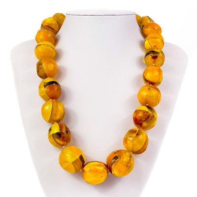 Lot 446 - An Amber sectional circular bead necklace.