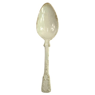 Lot 84 - A 19th century pearlware spoon with moulded foliate scroll decoration.