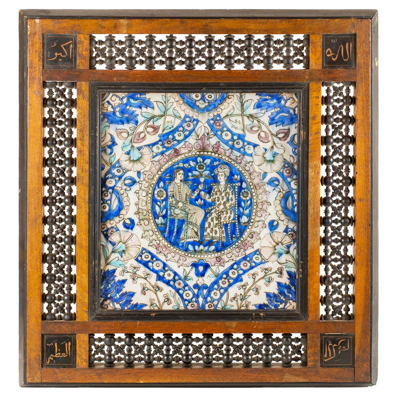 Lot 1 - A large Persian Qajar painted moulded pottery tile, 19th century.