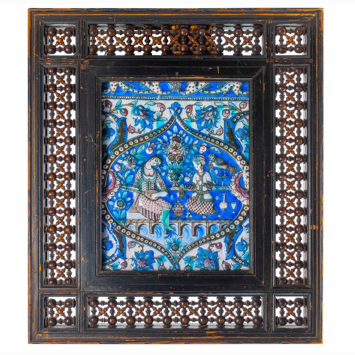 Lot 2 - A large Persian Qajar painted moulded pottery tile, 19th century.