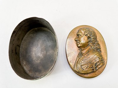 Lot 22 - A 19th century oval table snuff box embossed with a profile portrait of Cromwell.