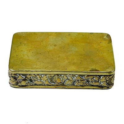 Lot 37 - An 18th century brass snuff box with repousse Griffins and foliate frieze panel.