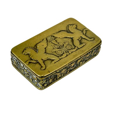 Lot 37 - An 18th century brass snuff box with repousse Griffins and foliate frieze panel.