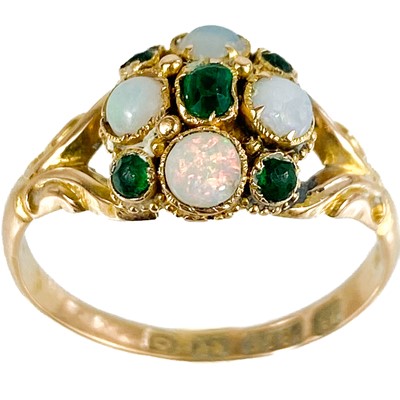 Lot 216 - A Victorian 15ct gold emerald and opal set nine stone ring.