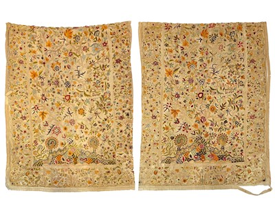 Lot 196 - A pair of crewelwork fabric panels adapted into curtains.