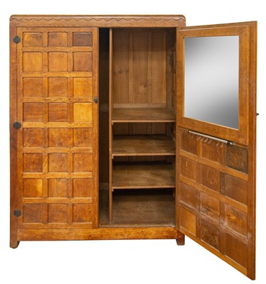 Lot 1819 - A Robert Mouseman Thompson of Kilburn oak panelled double wardrobe.