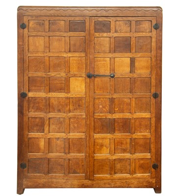 Lot 1819 - A Robert Mouseman Thompson of Kilburn oak panelled double wardrobe.