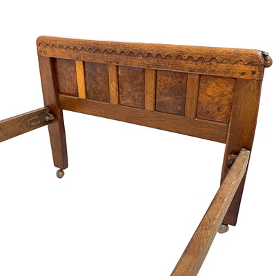 Lot 1818 - A Robert Mouseman Thompson of Kilburn oak panelled single bed frame.
