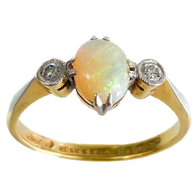 Lot 264 - An early 20th century 18ct and platinum diamond and opal set three stone ring.