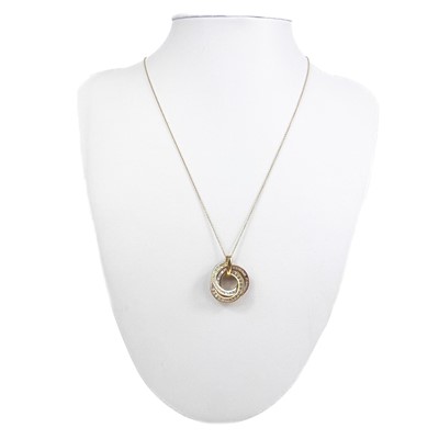 Lot 189 - A contemporary 9ct tri-colour gold white stone set pendant necklace.