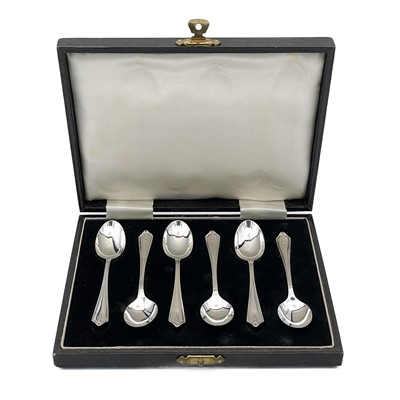 Lot 220 - A cased set of six silver 'Silver Hallmarks' teaspoons by Travis, Wilson & Co Ltd.