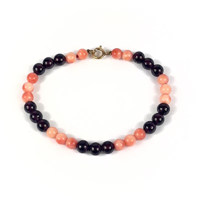 Lot 26 - A coral and garnet bead bracelet with 9ct clasp.