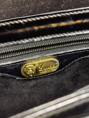Lot 345 - A Gucci black patent leather evening handbag.