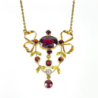 Lot 12 - A 14ct gold Edwardian style garnet and white stone set pendant necklace.