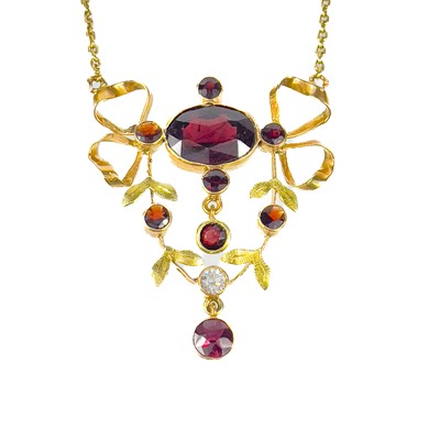 Lot 12 - A 14ct gold Edwardian style garnet and white stone set pendant necklace.