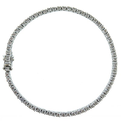 Lot 154 - An 18ct white gold diamond set line bracelet.