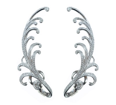 Lot 233 - Chopard - A remarkable and unique pair 18ct white gold diamond set ear clips.