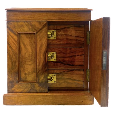 Lot 123 - A Victorian walnut miniature collectors cabinet.