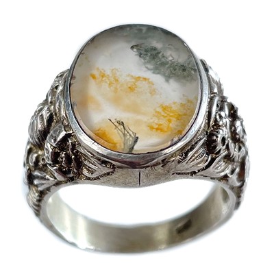 Lot 103 - An 835 silver Arts & Crafts style moss agate set ring.