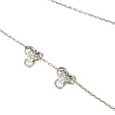 Lot 14 - A platinum necklace with two sliding diamond set pendants.