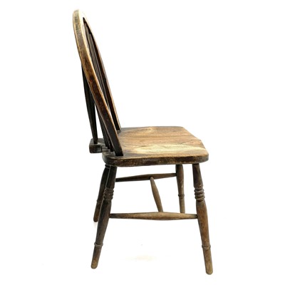 Lot 47 - An ash and elm wheelback chair.