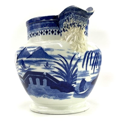 Lot 45 - A blue and white Chinoiserie printed porcellanous jug
