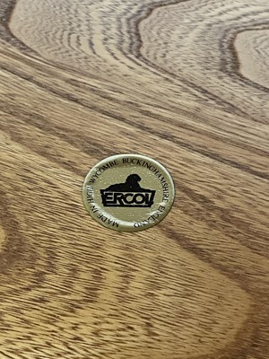 Lot 431 - An Ercol Windsor light elm three tier trolley with lipped edges.