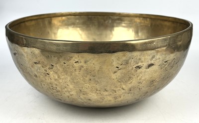 Lot 285 - A Tibetan hammered and polished bronze singing bowl.