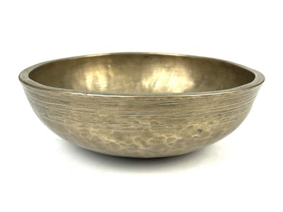 Lot 286 - A Tibetan polished bronze singing bowl.