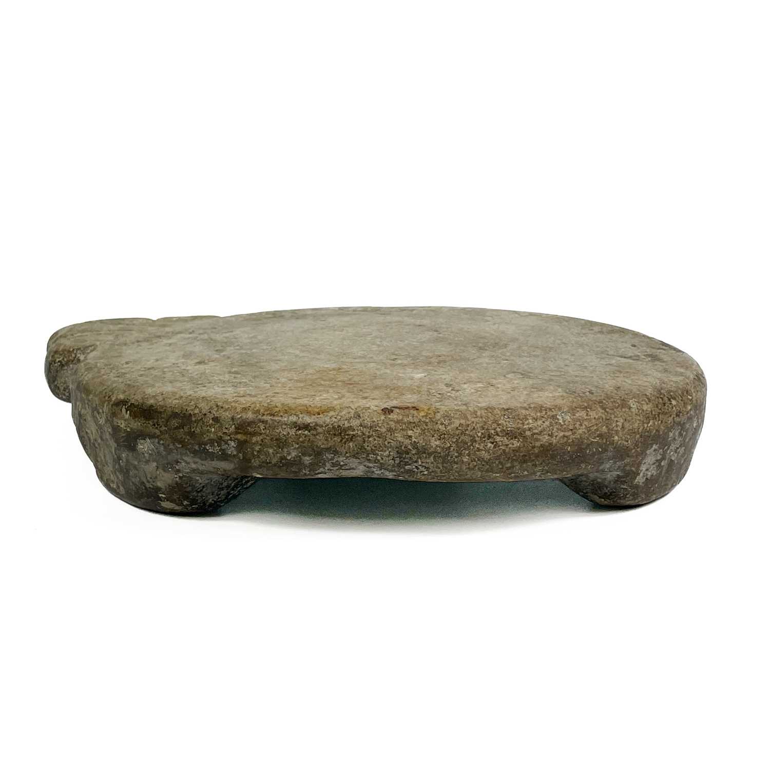 Lot 12 - An Indian carved stone chapati board.