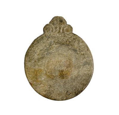 Lot 12 - An Indian carved stone chapati board.