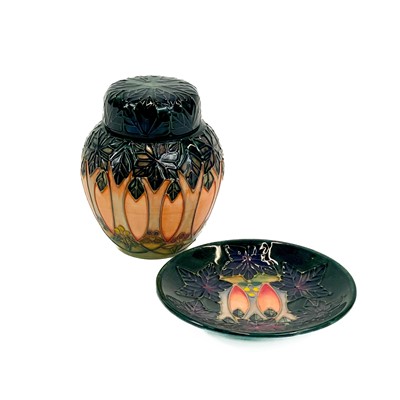 Lot 887 - A small Moorcroft pottery ginger jar and cover on the Cluny pattern.