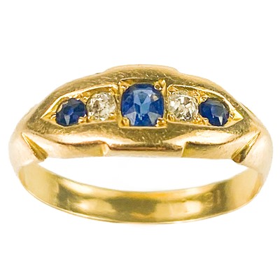 Lot 141 - An 18ct gold diamond and sapphire five stone ring.