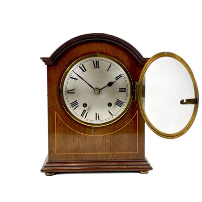 Lot 1709 - An Edwardian mahogany dome top mahogany and line inlaid mantel clock.