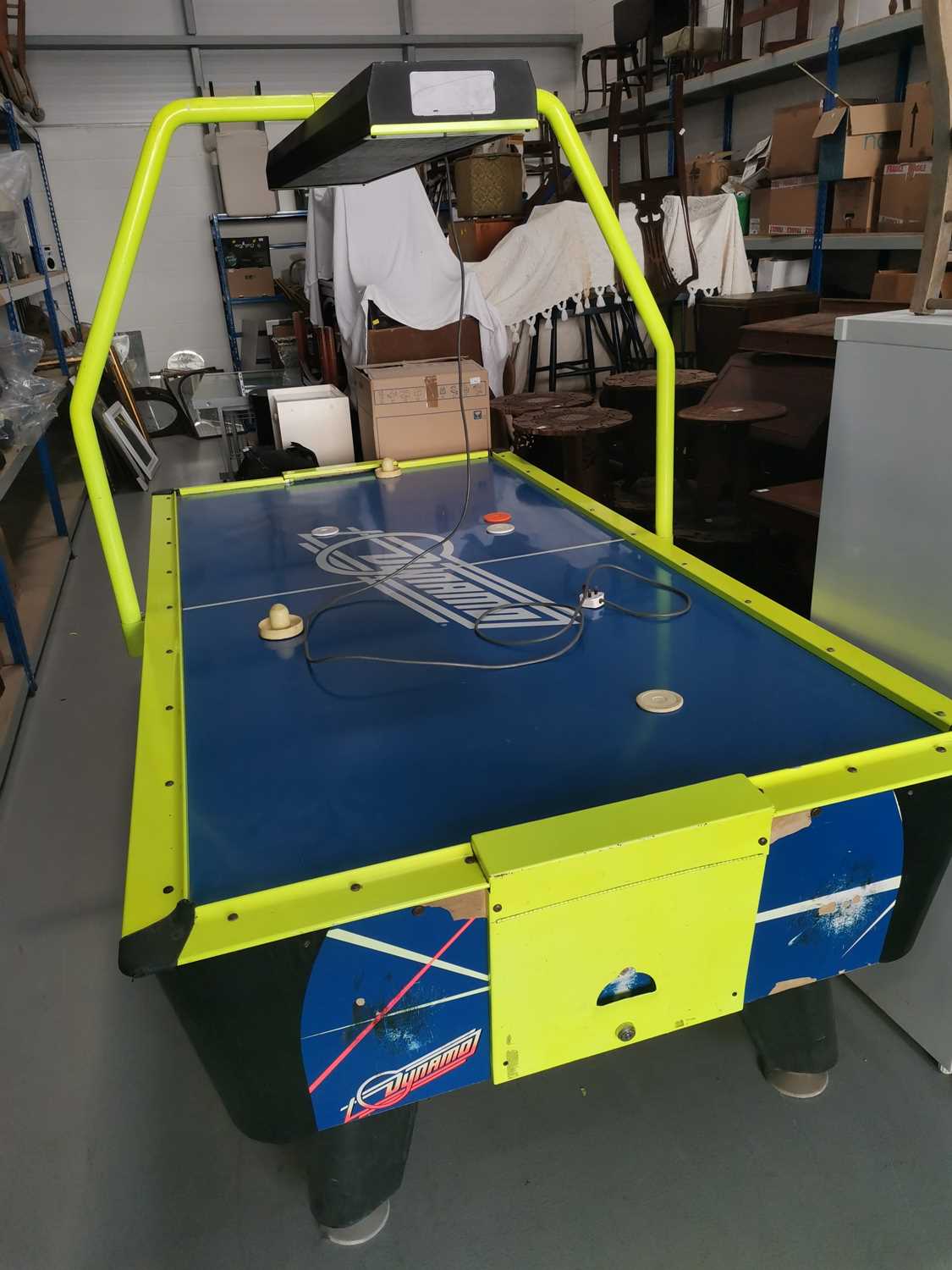 Lot 103 A Dynamo air hockey table, powers on but the