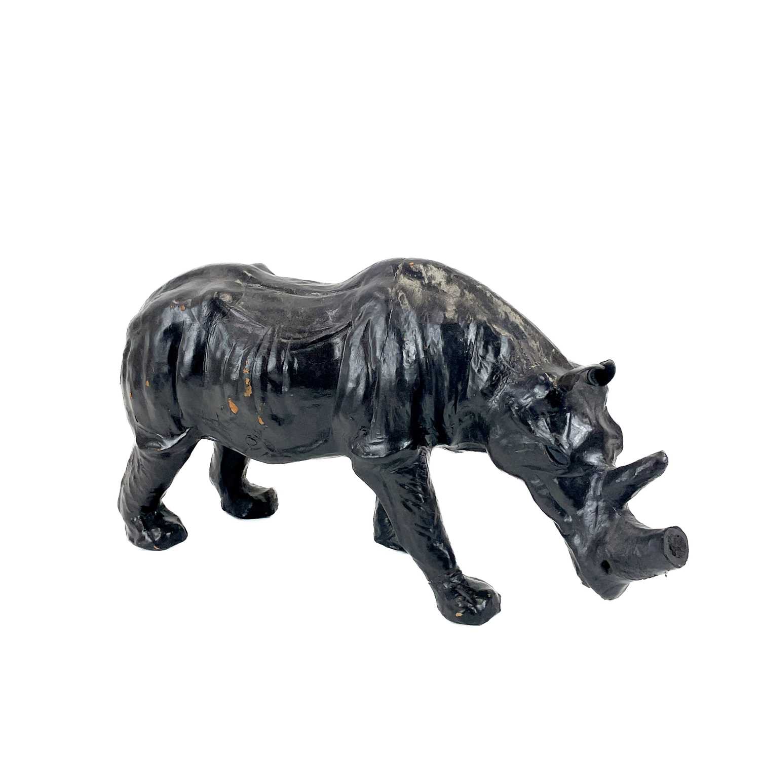 Lot 99 - A Liberty style leather clad model of a rhino.