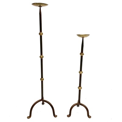 Lot 129 - Two wrought iron pricket candleholders in sizes.