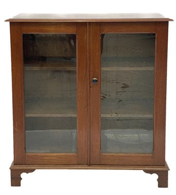 Lot 1835 - A late Victorian oak double front low bookcase.