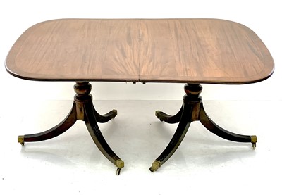 Lot 1861 - A 19th century mahogany twin pedestal dining table.