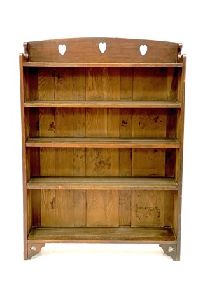 Lot 1858 - A Liberty & Co Arts and Crafts oak open bookcase.