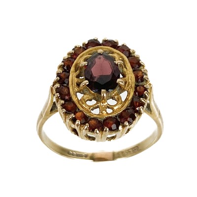 Lot 50 - A 9ct garnet set cluster dress ring.